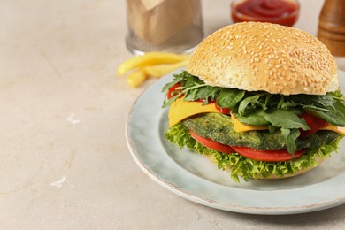 Photo of Tasty vegetarian burger with spinach cutlet, cheese and vegetables served on white table, closeup. Space for text