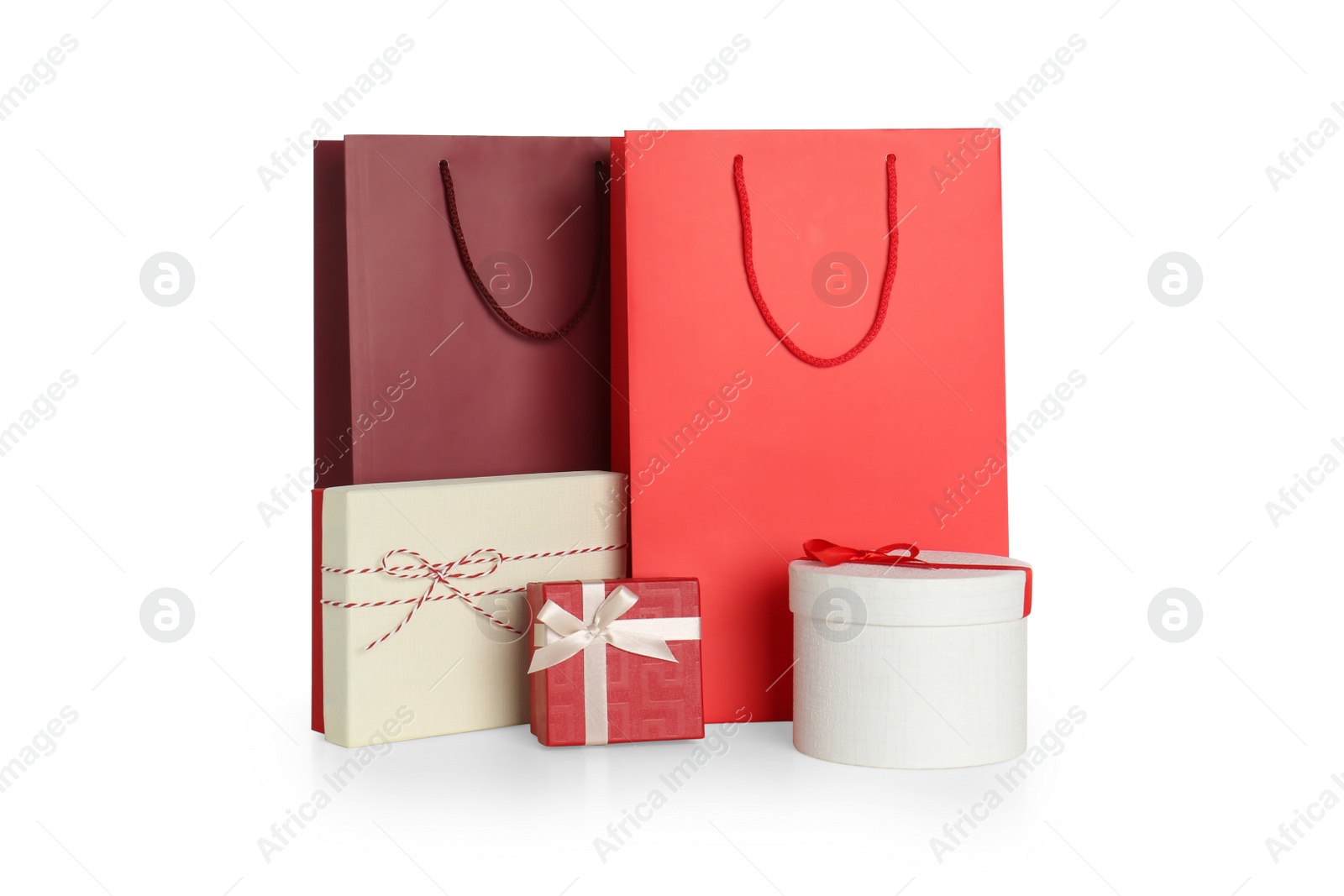 Photo of Paper bags and gift boxes isolated on white