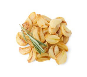 Photo of Pile of fried garlic cloves and rosemary isolated on white, top view