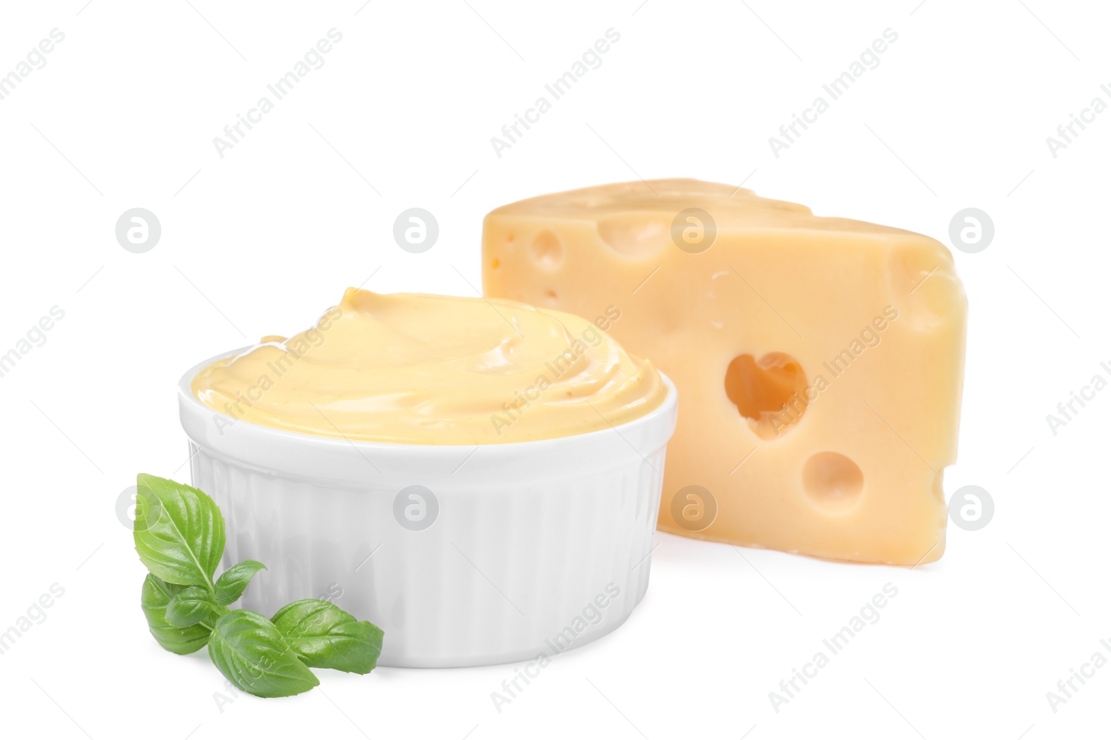 Photo of Tasty cheese, sauce and basil on white background