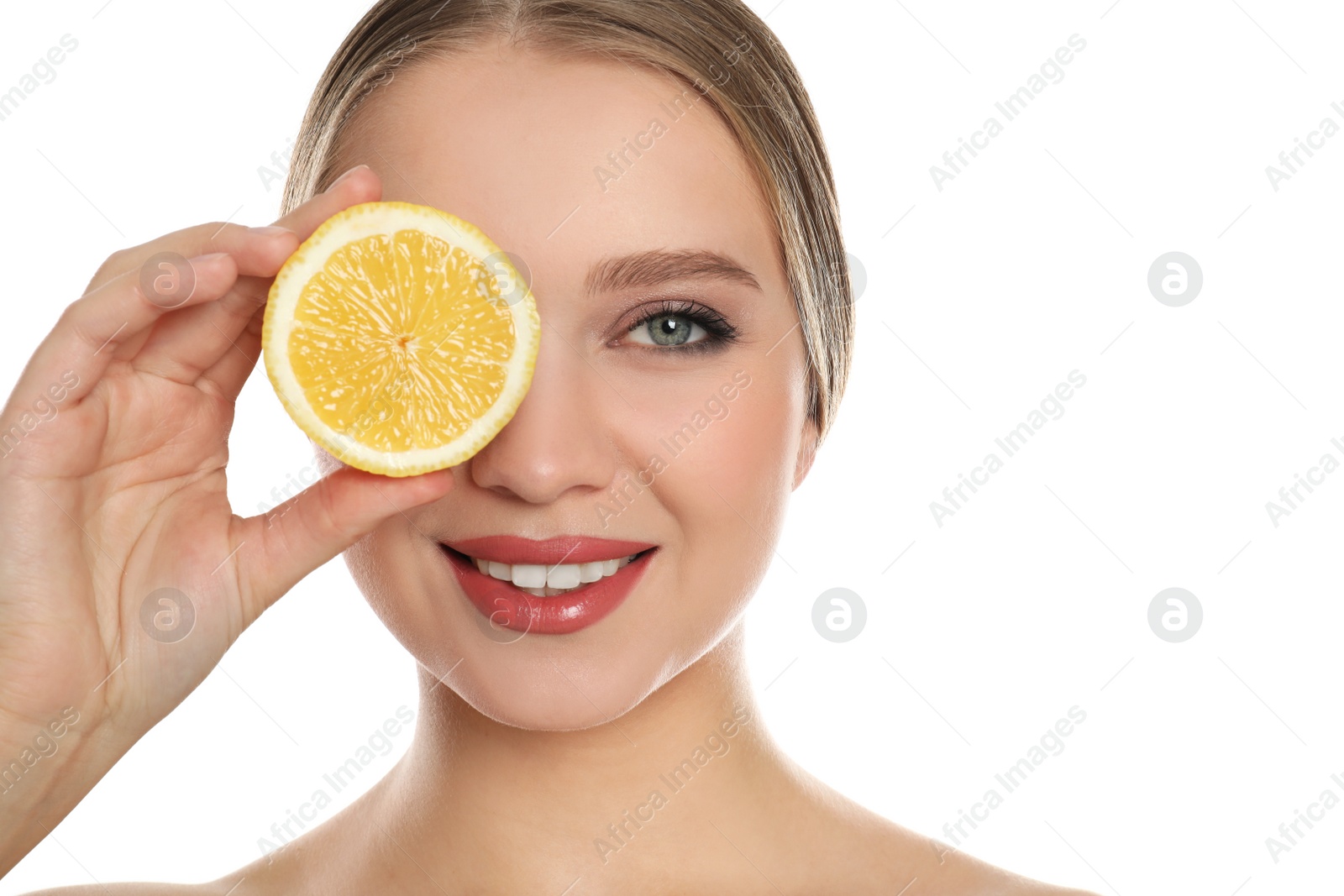 Photo of Young woman with cut lemon on white background. Vitamin rich food