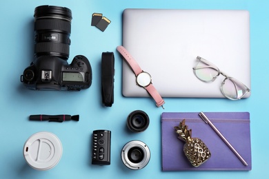 Photo of Flat lay composition with photographer's equipment and accessories on color background
