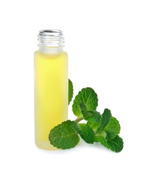Photo of Bottle with mint essential oil and fresh herb on white background