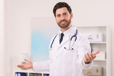 Photo of Portrait of medical consultant with stethoscope in clinic