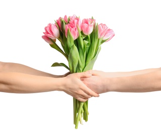 Photo of Man and lady holding bouquet of beautiful spring tulips on light background, closeup. International Women's Day