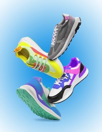 Image of Different sneakers falling on blue gradient background
