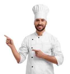 Photo of Smiling mature male chef pointing at something on white background