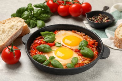 Delicious Shakshuka served on light grey table