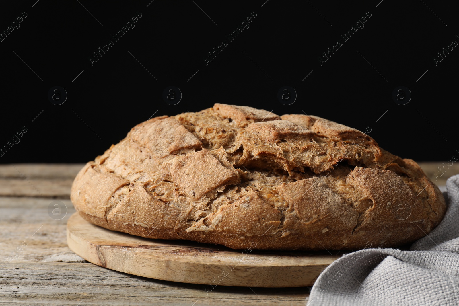 Freshly baked sourdough bread on wooden table Photo of Freshly baked sourdough bread on wooden table