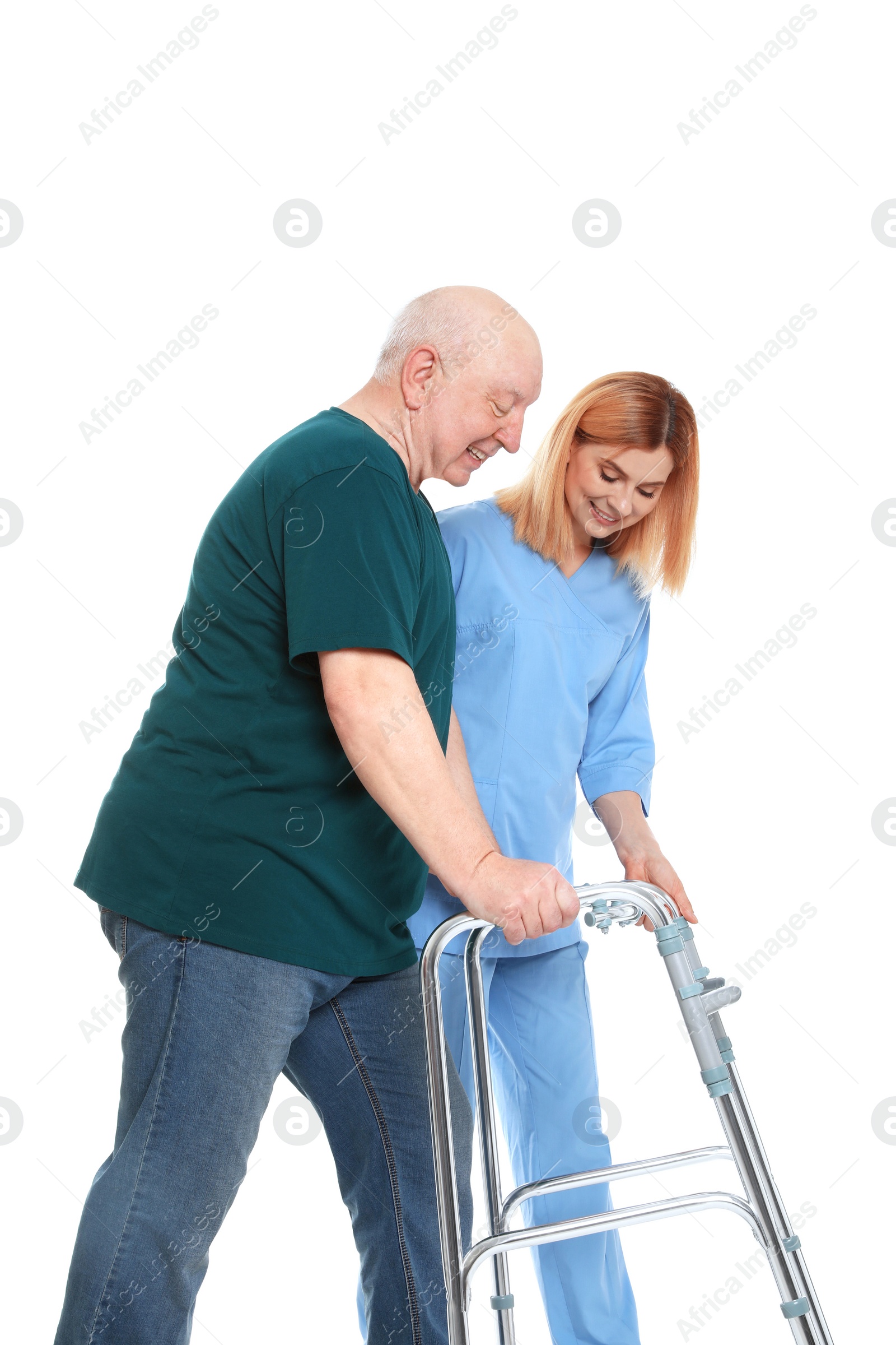 Photo of Caretaker helping elderly man with walking frame on white background