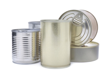Many closed tin cans on white background