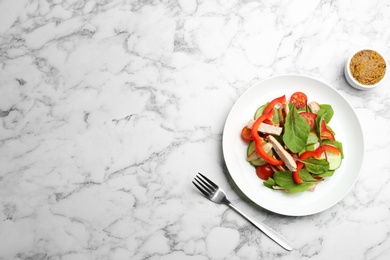 Photo of Delicious fresh chicken salad served on white marble table, flat lay. Space for text