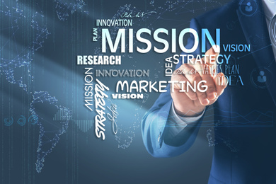 Mission concept. Businessman using virtual screen, closeup