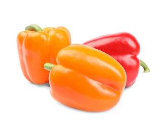 Fresh ripe bell peppers on white background