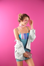 Photo of Beautiful young woman posing on color background. Summer fashion
