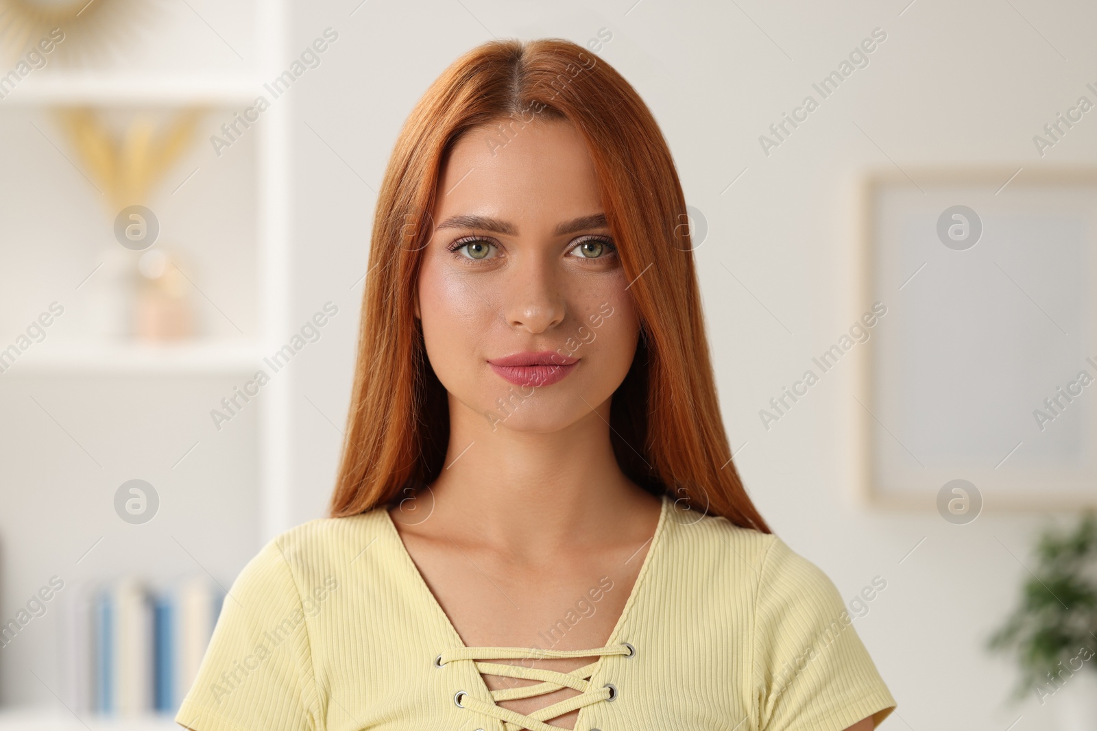 Photo of Portrait of beautiful young woman on blurred background