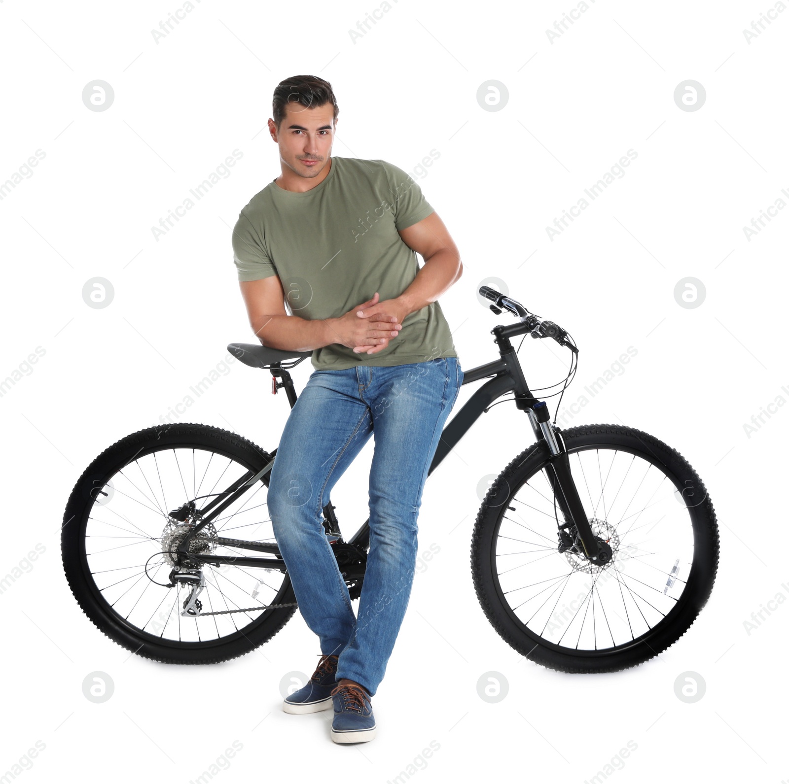 Photo of Handsome young man with modern bicycle on white background