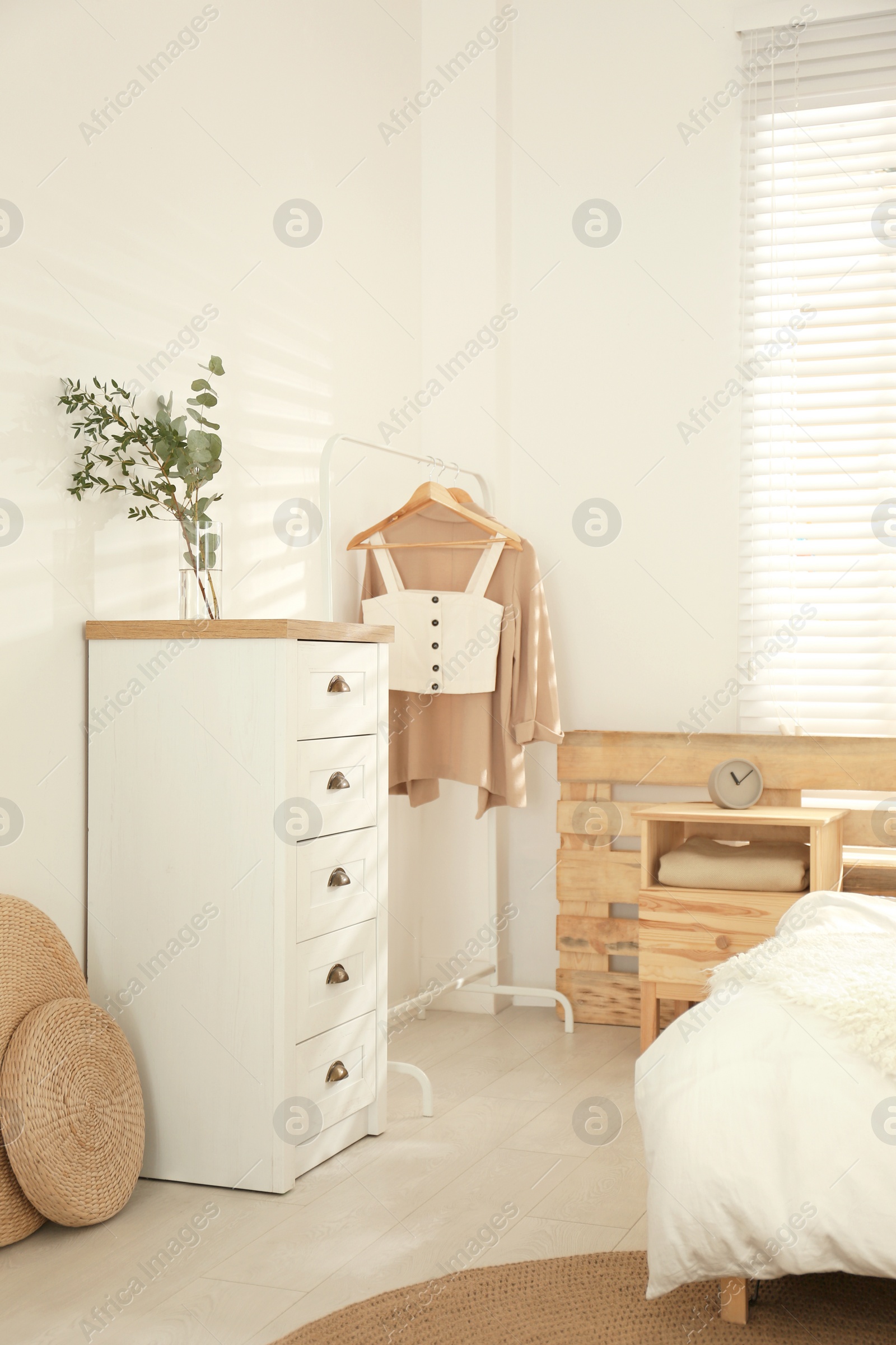 Photo of Stylish bedroom with modern chest of drawers