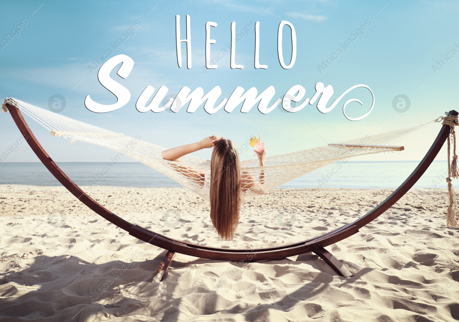 Image of Hello Summer. Young woman with refreshing cocktail relaxing in hammock on beach