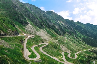 Photo of Picturesque landscape with mountains and winding road