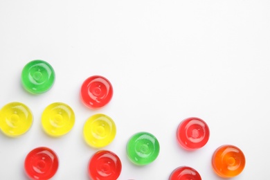 Photo of Delicious colorful candies on white background, top view