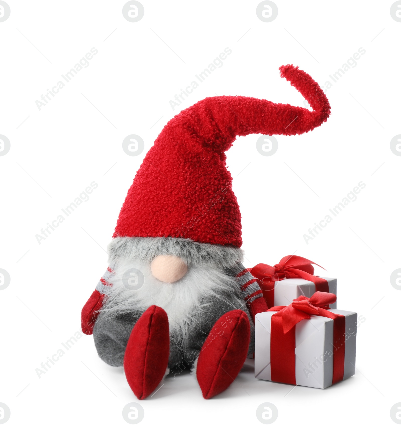 Photo of Funny Christmas gnome with gift boxes on white background