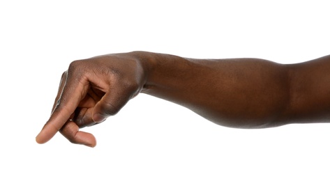 African-American man pointing at something on white background, closeup