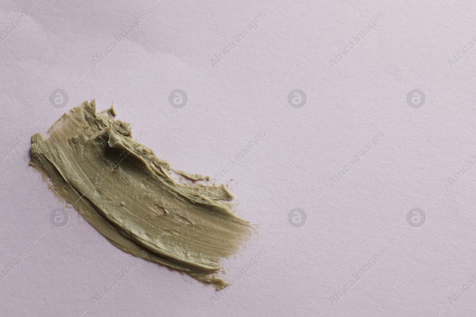 Photo of Sample of face mask on pink background, top view. Space for text
