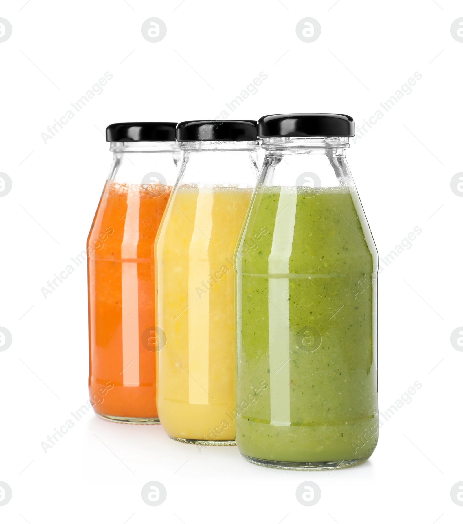 Photo of Bottles of fresh juices on white background