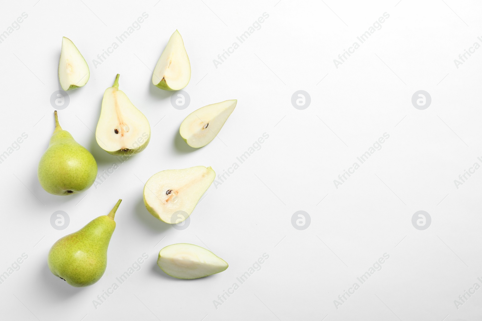 Photo of Ripe juicy pears on white background, top view