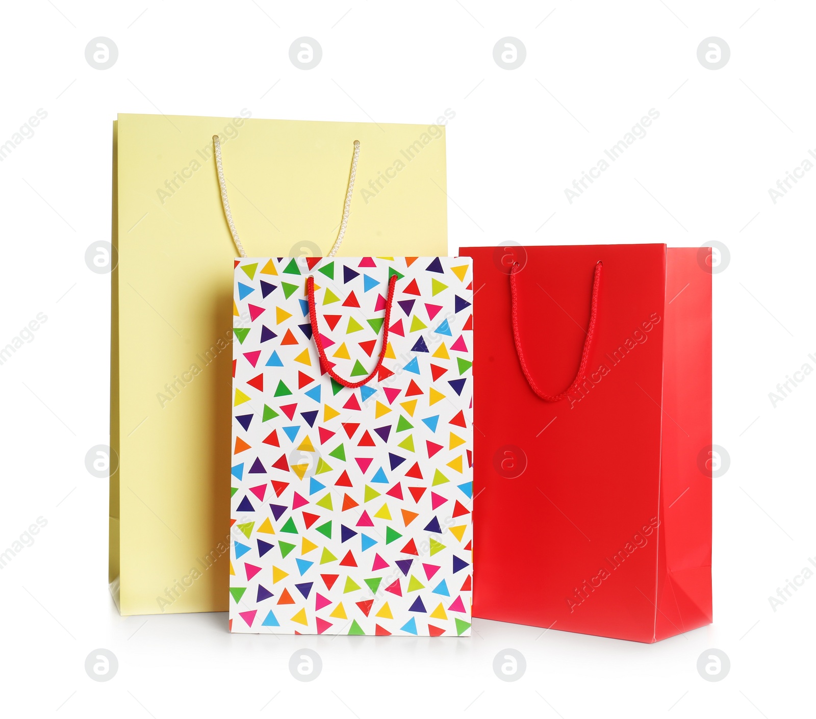 Photo of Stylish gift paper bags isolated on white