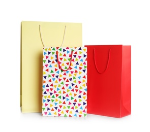 Stylish gift paper bags isolated on white