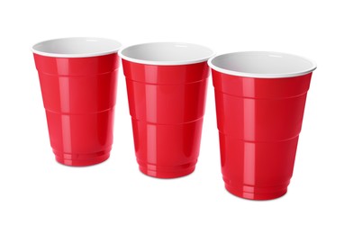 Photo of Red plastic cups on white background. Beer pong game