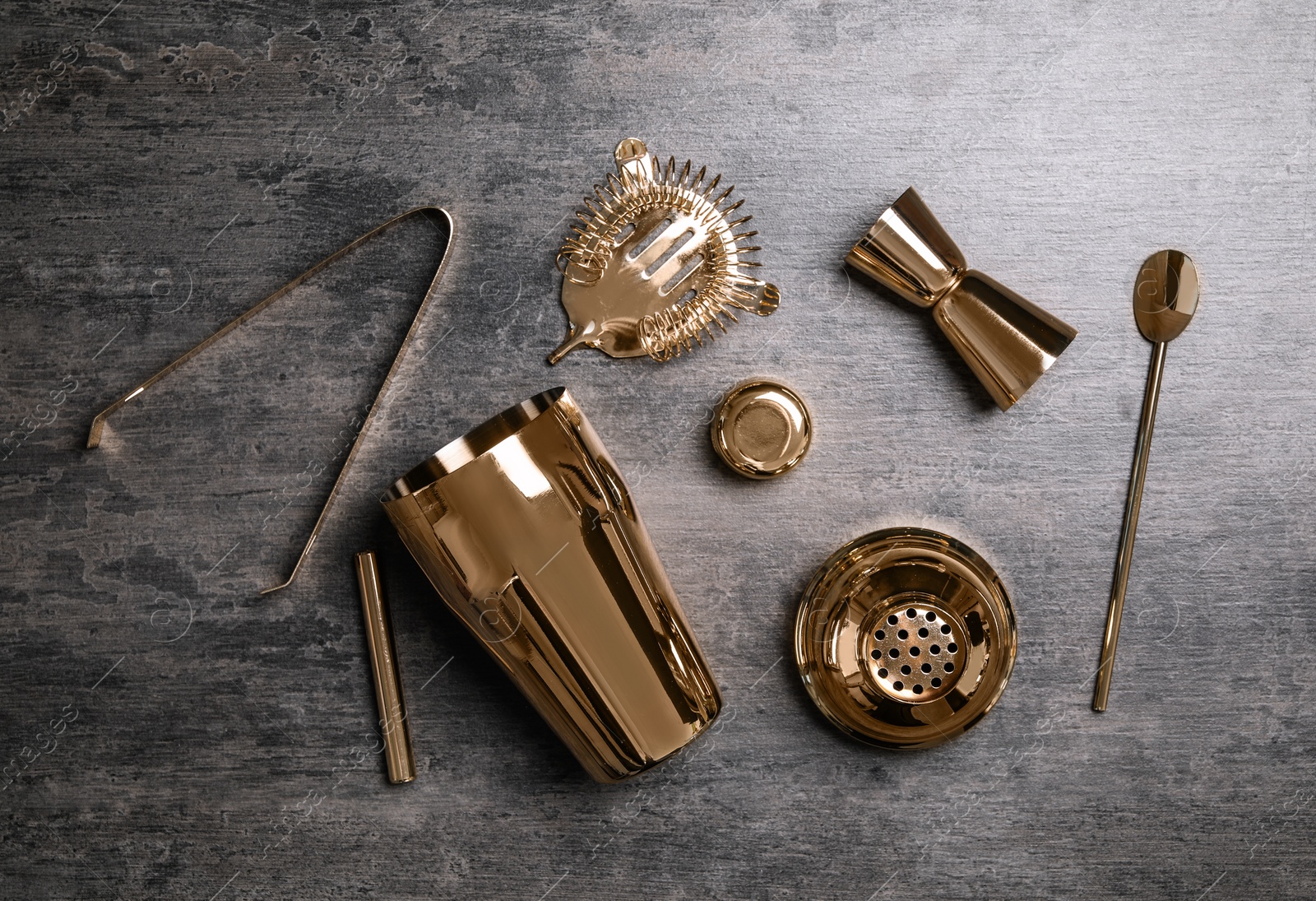 Photo of Set of bartender tools on grey table. Cooking utensils