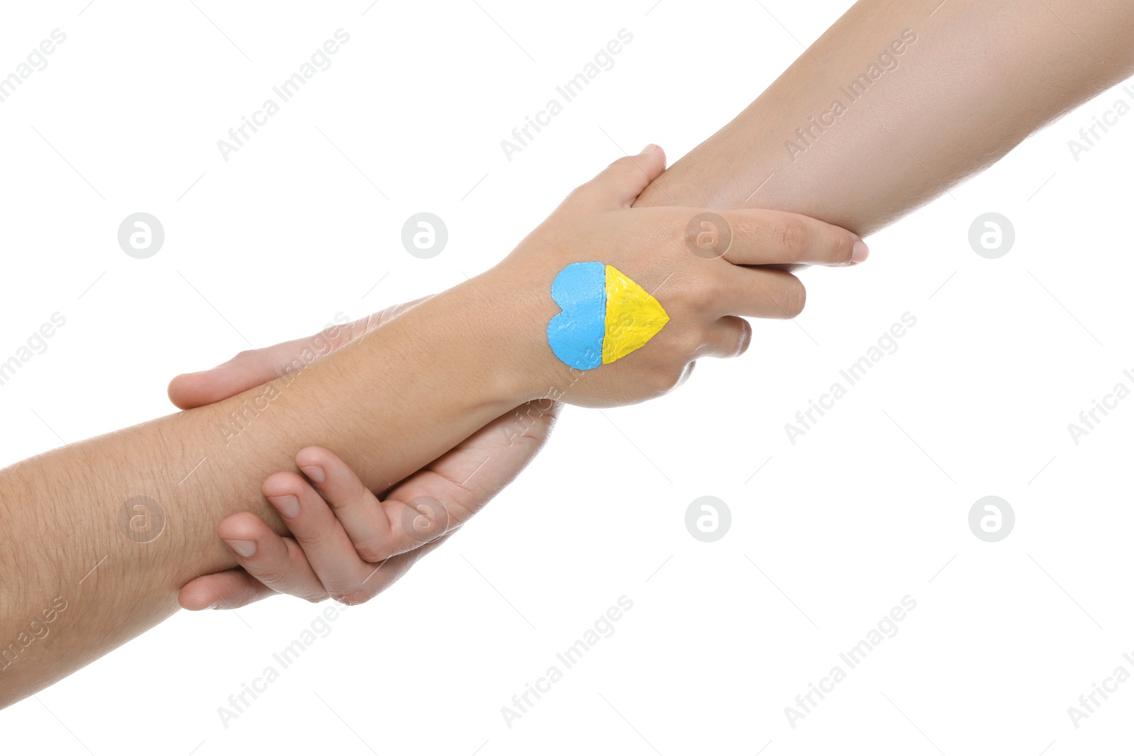 Photo of Man and woman with painted heart in colors of Ukrainian flag on her hand against white background, closeup