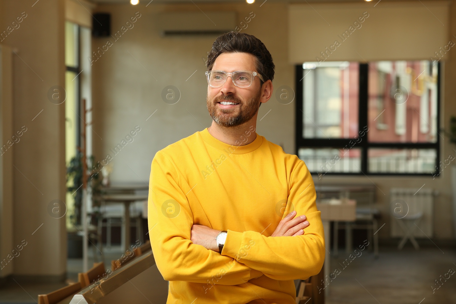 Photo of Portrait of handsome stylish man in cafe