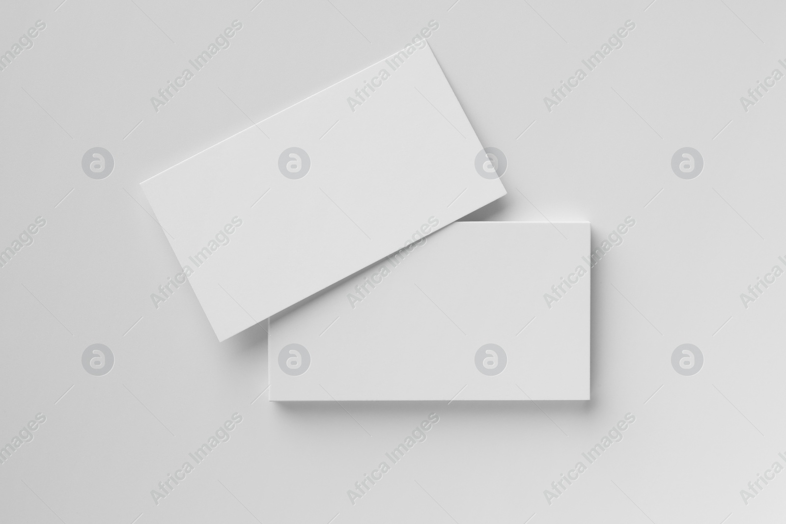 Photo of Blank business cards on white background, top view. Mockup for design