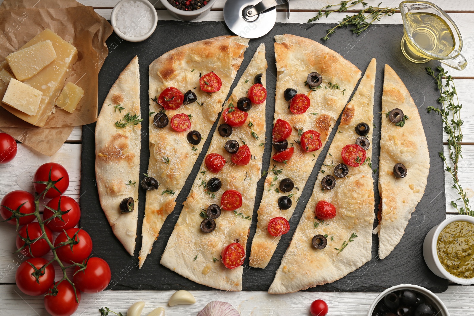 Photo of Flat lay composition with focaccia bread on white wooden table