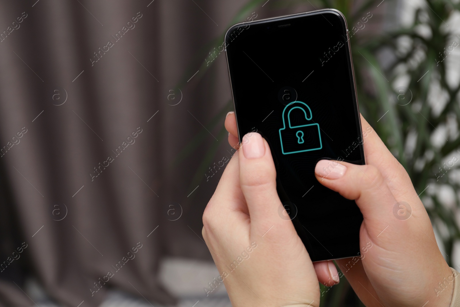 Photo of Woman holding smartphone with blocked screen indoors, closeup. Space for text