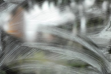 Cleaning foam on window glass, closeup view