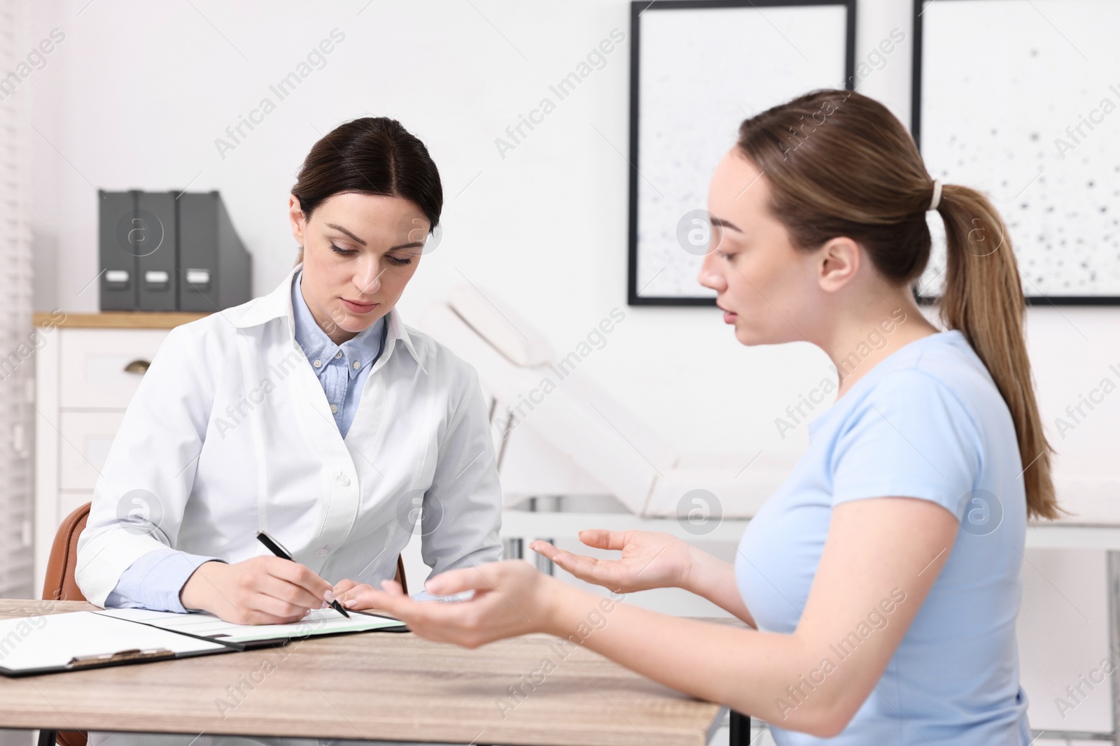 Photo of Mammologist's appointment. Doctor and woman in hospital