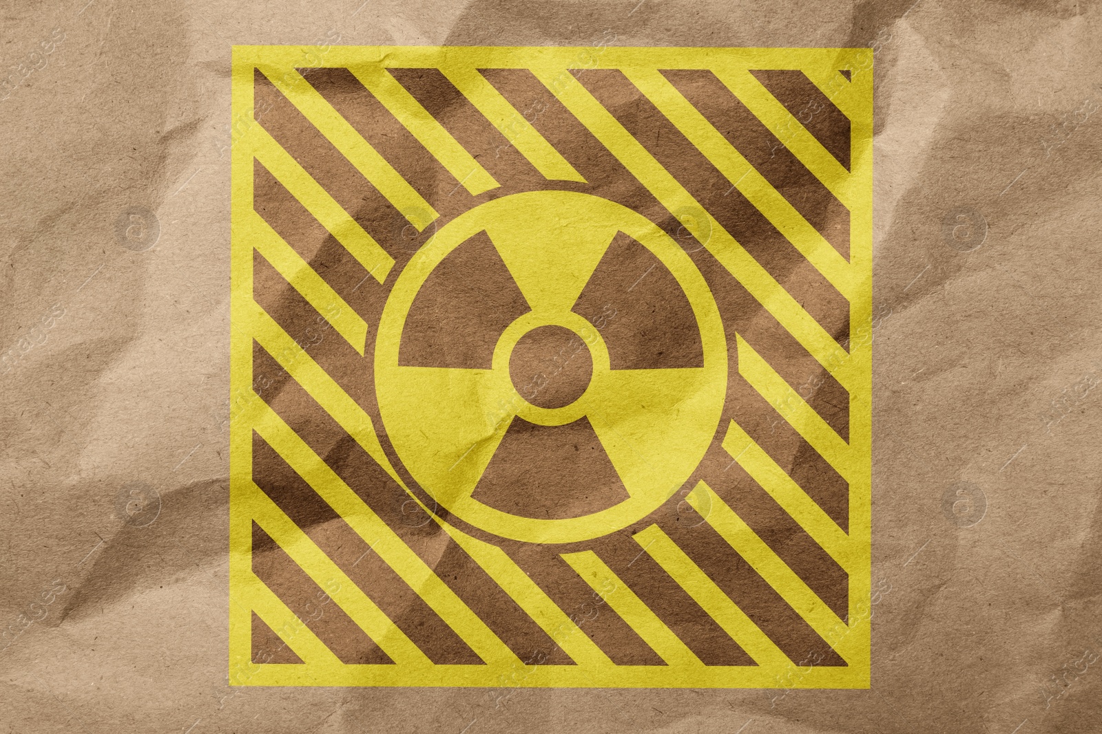 Illustration of Radioactive sign on crumpled kraft paper. Hazard symbol