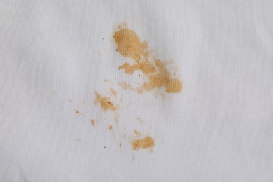 Photo of Closeup view of white shirt with stain