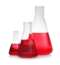Photo of Conical flasks with red liquid on white background. Laboratory glassware