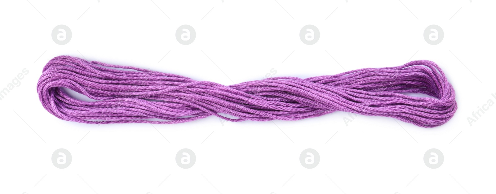 Photo of Bright violet embroidery thread on white background