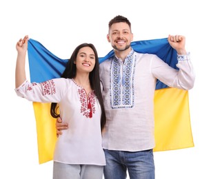 Photo of Happy couple with flag of Ukraine on white background