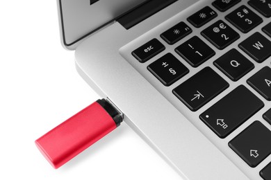 Photo of Usb flash drive attached into laptop on white background