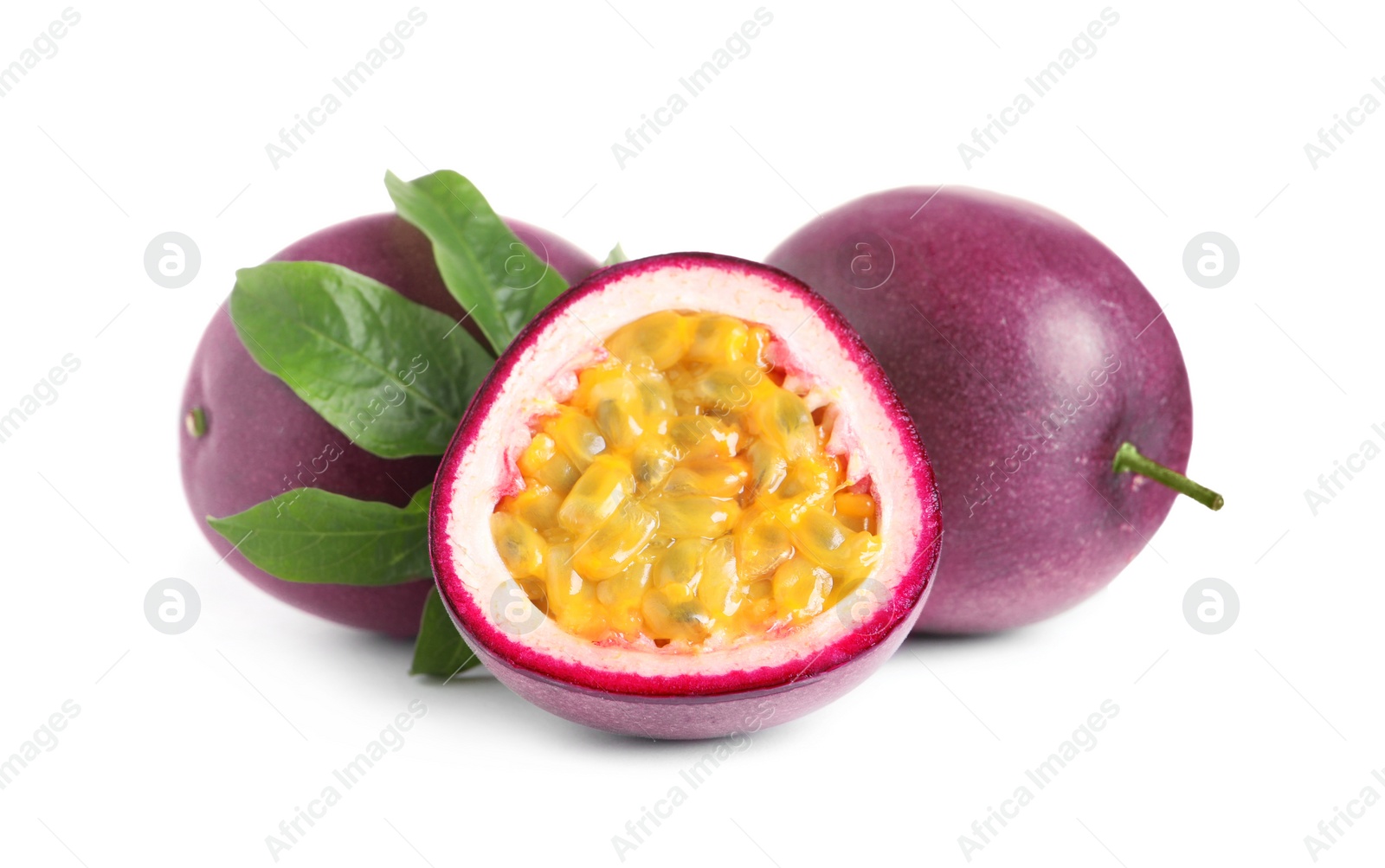 Photo of Cut and whole passion fruits with leaf isolated on white