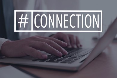Image of Hashtag Connection. Man working on laptop at wooden table, closeup