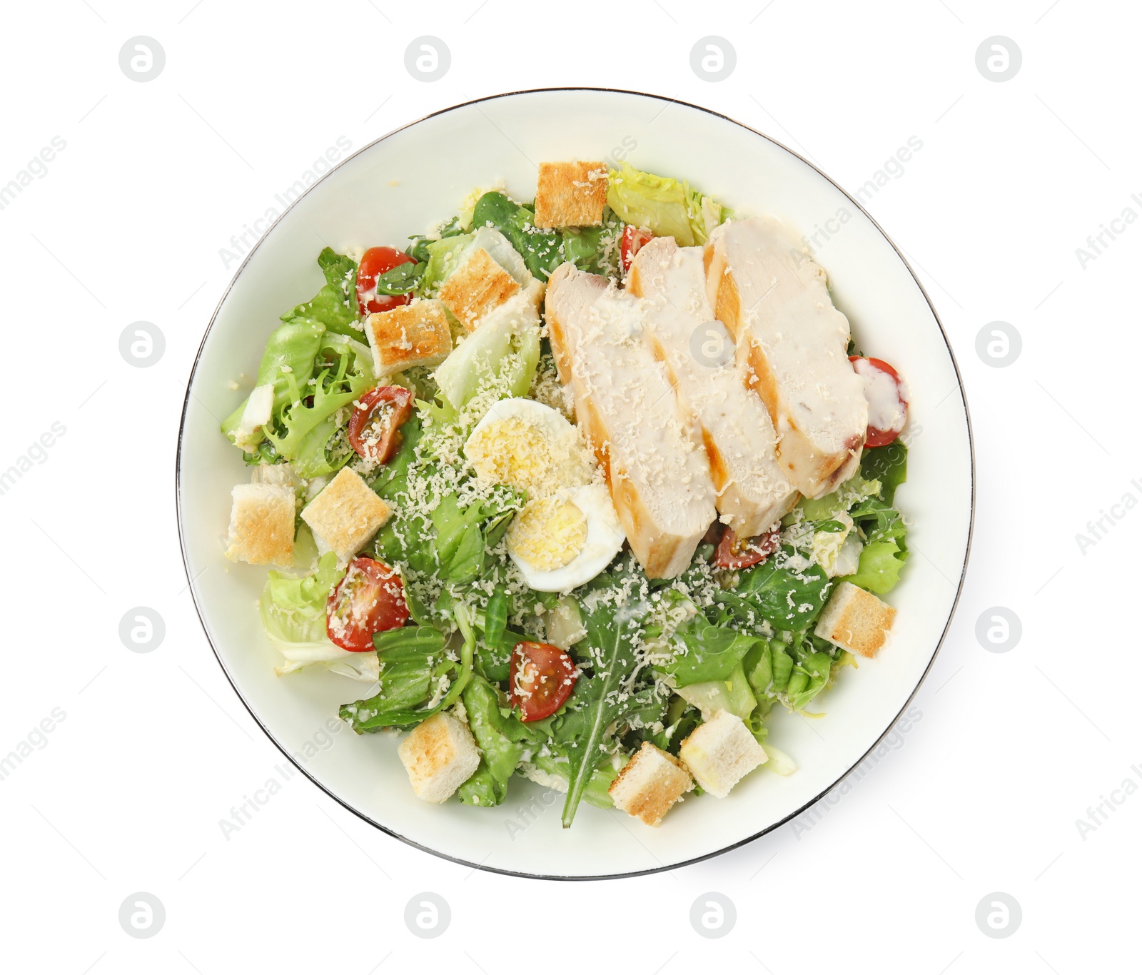 Photo of Delicious Caesar salad in bowl isolated on white, top view